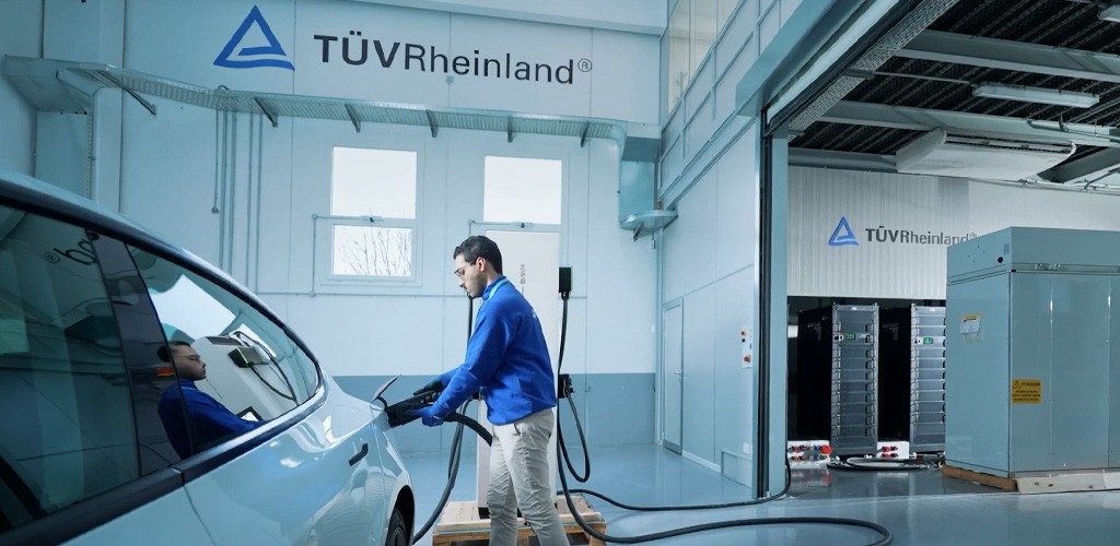 An employee tests the charging infrastructure for electric cars at the Power Test Center Cologne